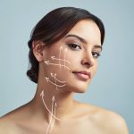 Studio portrait of a beautiful young woman with flawless skin against a grey background